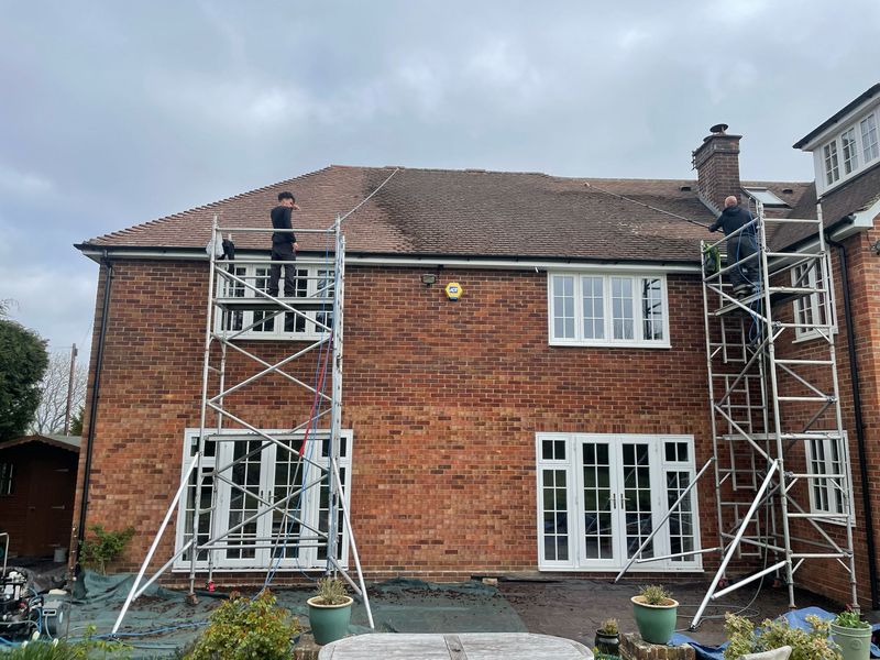 Roof cleaning carried out safely from scaffold towers by The Roof Moss Cleaners in Daventry
